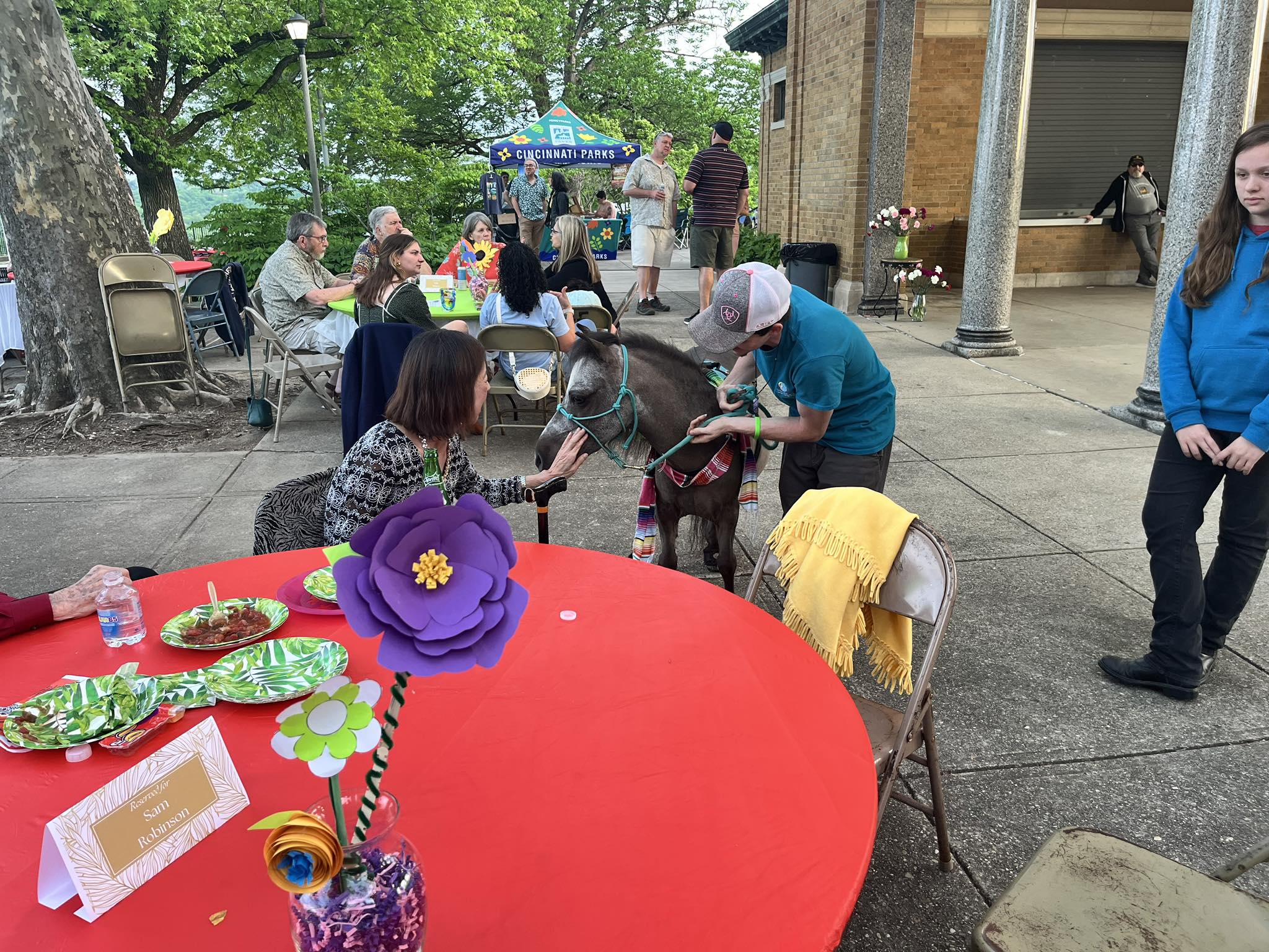 Sir Camelot greeting a guest during a Mother's Day gala