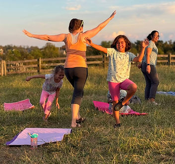 Children enjoying an outdoor wellness gathering