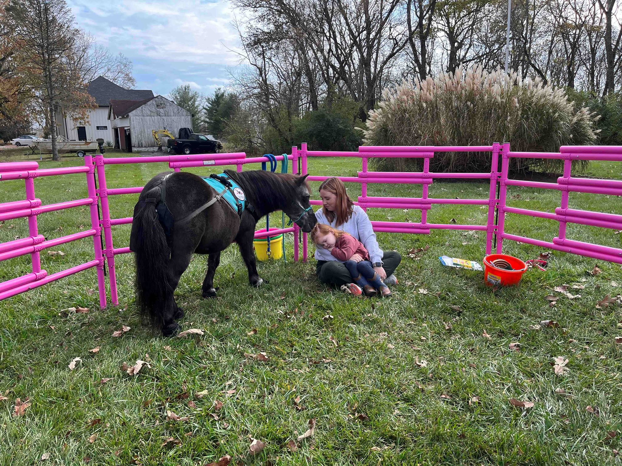 Sir Camelot sharing a gentle moment with a mother and child