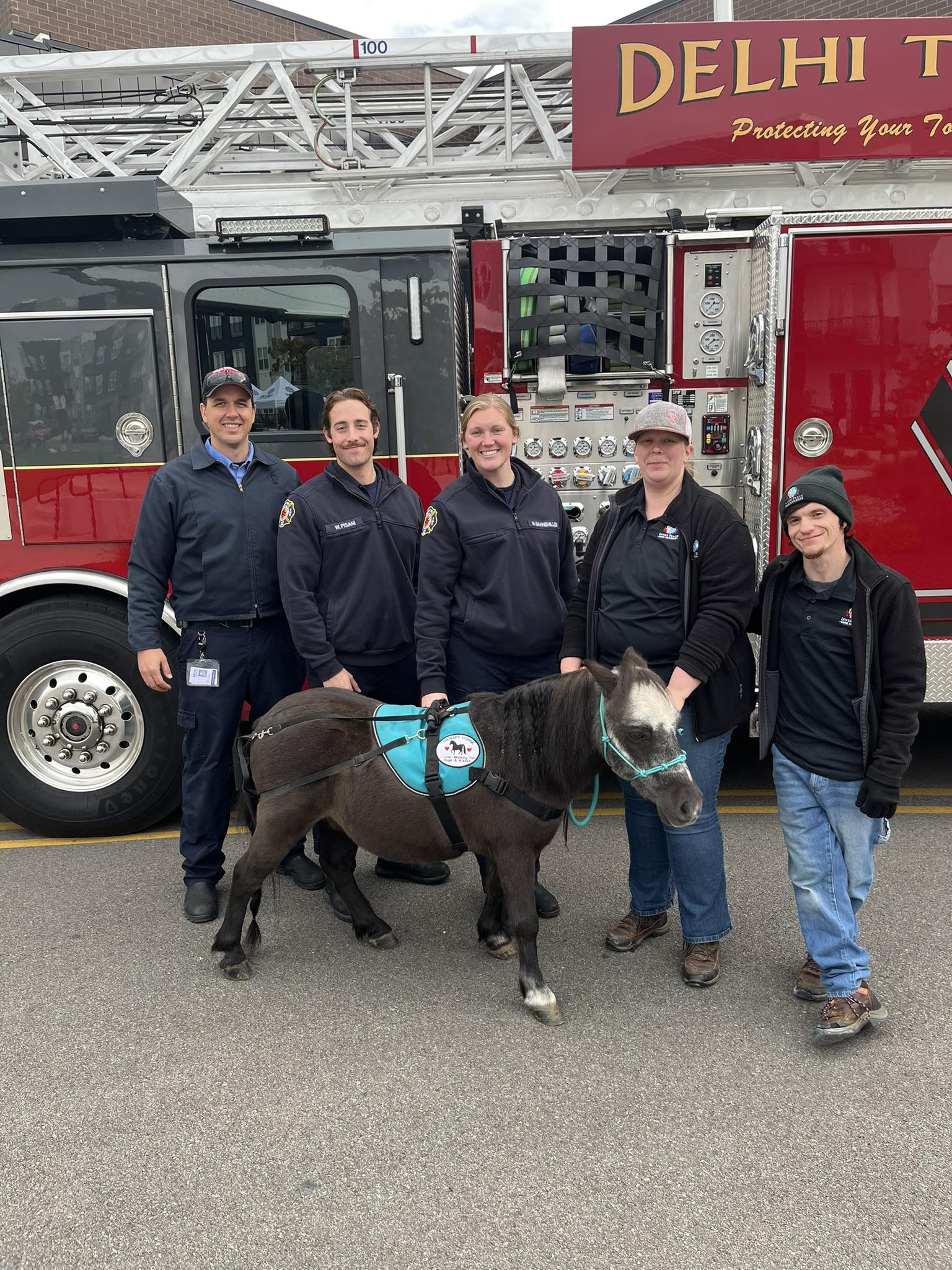 Sir Camelot and the Inner Peace team with members of the Delhi Township Fire Department